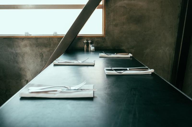 A set table by the window